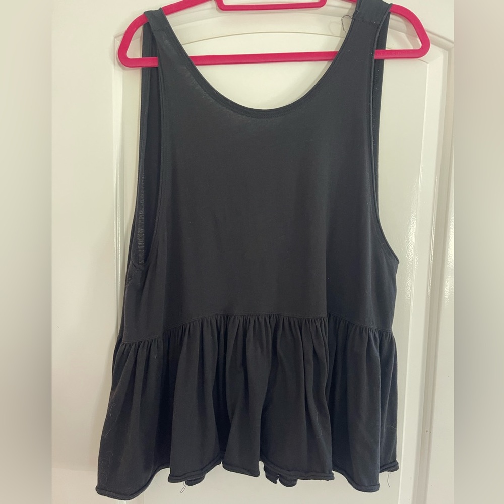 Free people black peplum top with low back, size L